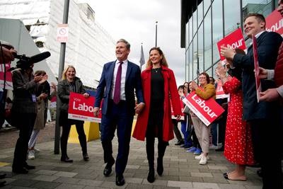 Labour party leader Sir Keir Starmer and his wife Victoria are greeted by supporters as they arrive before the start of the party's annual conference in Liverpool. PA