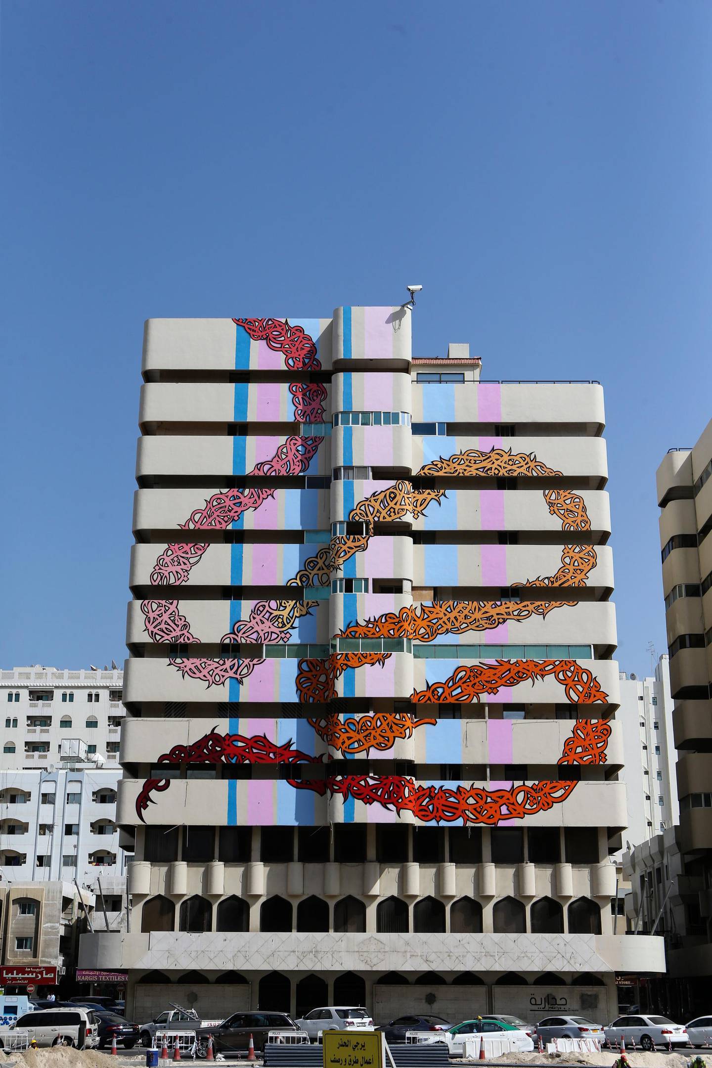 SHARJAH, UAE. February 15, 2015 -   Street artist eL Seed painted an abandoned building on Bank Street as part of the new initiative by the Sharjah government to bring art into public places, February 15, 2015. (Photos by: Sarah Dea/The National, Story by: Anna Seaman, Arts and Life) *** Local Caption ***  SDEA150215-elseed04.JPG