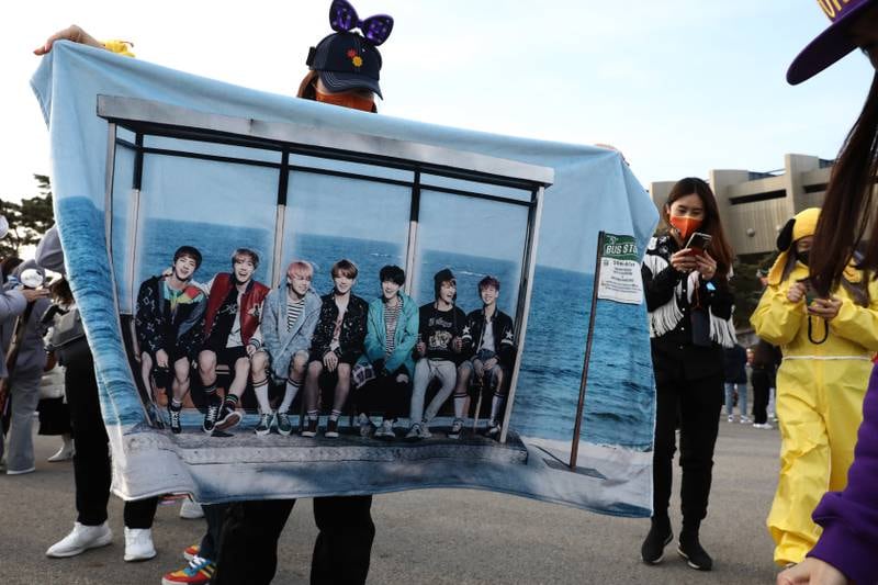 A BTS fan shares a photo of a towel with the group on it. Getty Images