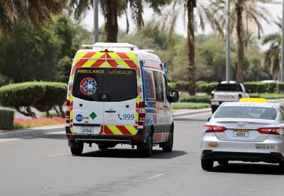 Al Ain, United Arab Emirates - Reporter: N/A: An ambulance goes down a street in Al Ain. Thursday, April 9th, 2020. Al Ain. Chris Whiteoak / The National