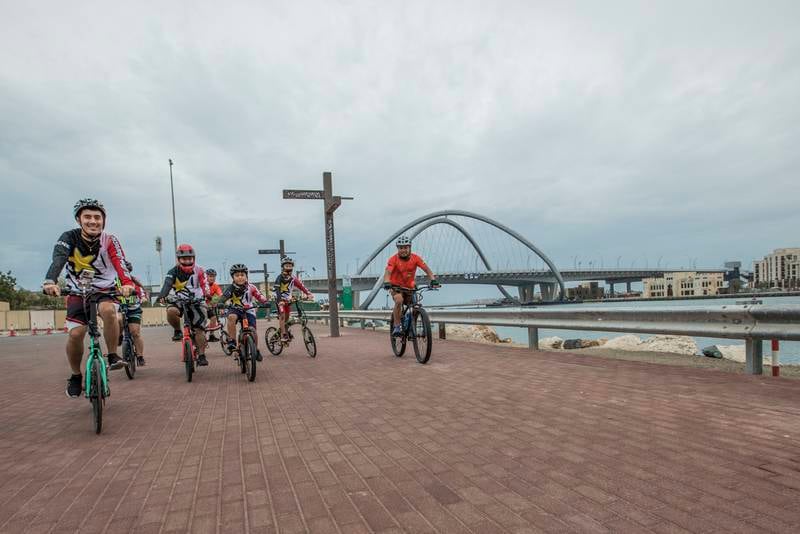 Cyclists brave the weather in Deira. Ruel Pableo for The National