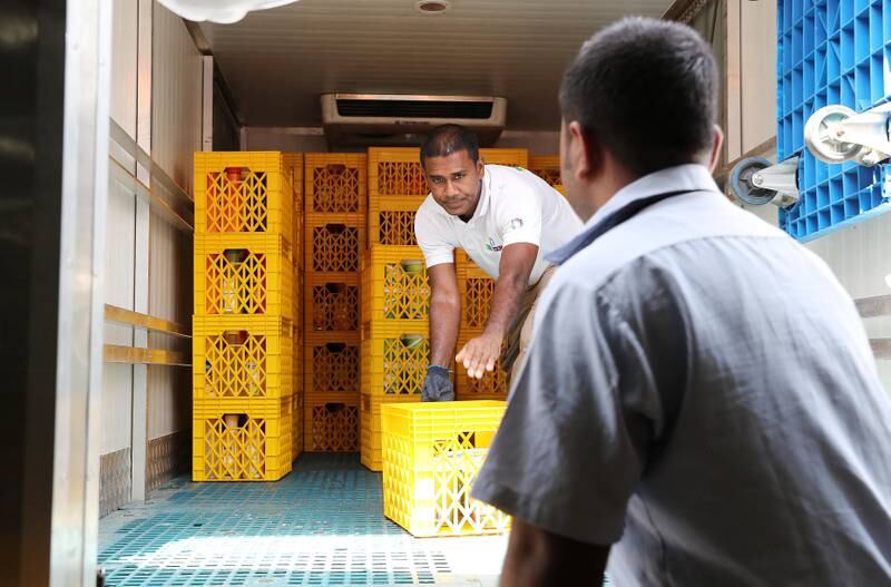 DUBAI , UNITED ARAB EMIRATES , JULY 11 – 2018 :- Workers unloading the food collection truck at the UAE Food Bank in Al Quoz with food stuff collected from different supermarkets , hotels and bakeries in Dubai.  ( Pawan Singh / The National )  For News. Story by Patrick Ryan