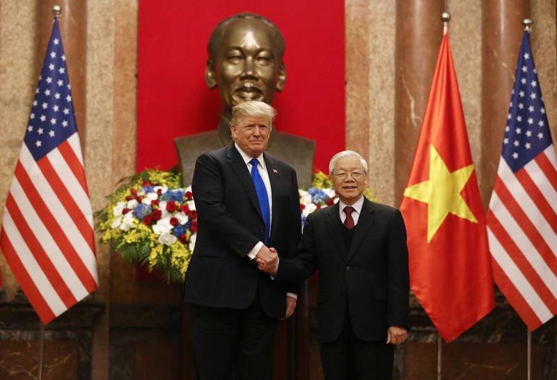 US President Donald Trump shakes hands with Vietnamese President Nguyen Phu Trong during their meeting at the Presidential Palace in Hanoi, Vietnam. Reuters