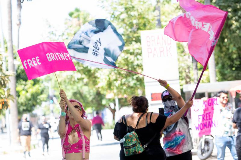 Fans and supporters of Britney Spears wave "Free Britney" flags as they gather outside the Los Angeles County Courthouse during a scheduled hearing in the Britney Spears guardianship case, in Los Angeles on July 19, 2021.