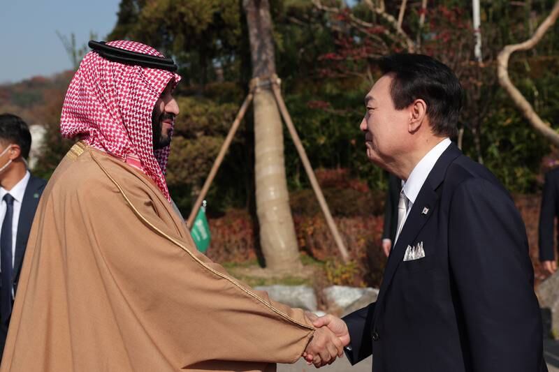 Mr Yoon welcomes the Crown Prince to South Korea. EPA