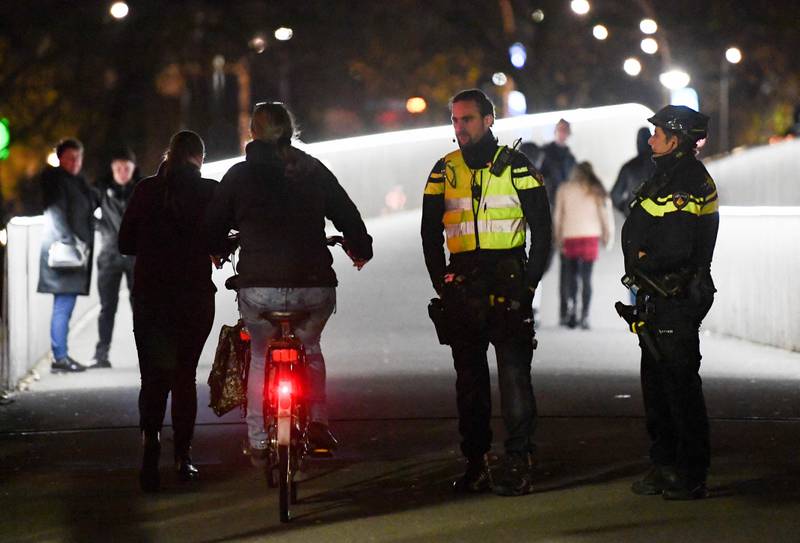 Police patrol the centre of the northern city of Zwolle, where an emergency order is in force after three nights of unrest in the Netherlands over new Covid-19 measures. AFP
