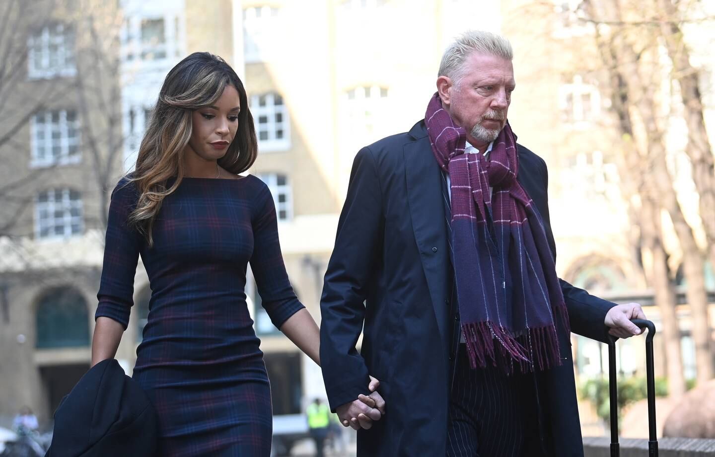 Former Wimbledon Champion and sports commentator Boris Becker arrives with his partner Lilian de Carvalho at Southwark Crown Court in London, on March 24. Becker is in court after declaring bankruptcy. EPA