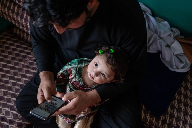 Rafiullah Sharifi with his daughter Amina, who was injured by bullets when a maternity hopsital was attacked in Kabul last May, killing 24 people; most of them mothers and babies.Amina, whose mother died in the attack, has had several surgeries to save her leg that has been hit by three bullets. 