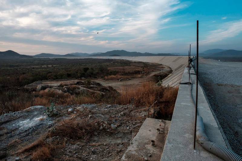 (FILES) In this file photo taken on December 27, 2019 a general view of the Saddle Dam, part of the Grand Ethiopian Renaissance Dam (GERD), near Guba in Ethiopia. Progress towards a final agreement between Egypt, Ethiopia and Sudan over what is set to be Africa's largest dam has eased tensions around Addis Ababa's mega-project on the Nile. Egypt released a statement on January 16, 2020 toning down years of rhetoric and suggesting a conciliatory approach ahead of a final accord. That came shortly after the three countries announced a meeting in Washington on January 28-29 to finalise the deal. / AFP / EDUARDO SOTERAS
