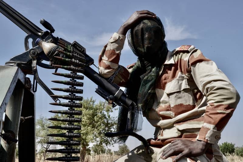 Niger Army soldier takes a breather during security patrol near the Nigerian border on the hunt for Boko Haram militants.