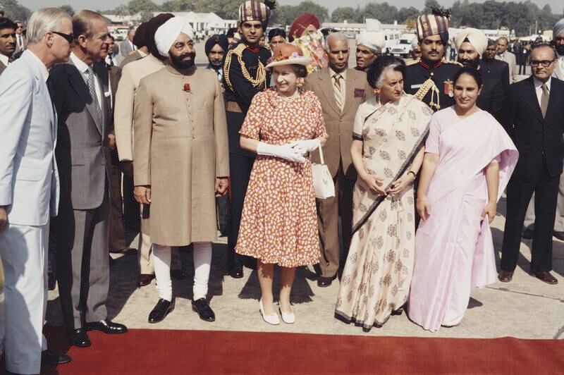 Queen Elizabeth II and Prince Philip are met by Indian Prime Minister Indira Gandhi and President Zail Singh at Palam Airport, New Delhi, during a Commonwealth tour of India. November 17, 1983.  Getty Images