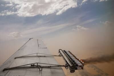 Flares are released during a cloud-seeding flight between Al Ain and Al Hayer.