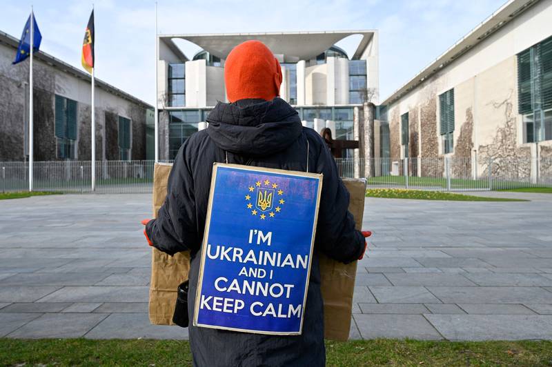 A demonstrator in front of the German Chancellery in Berlin. AFP