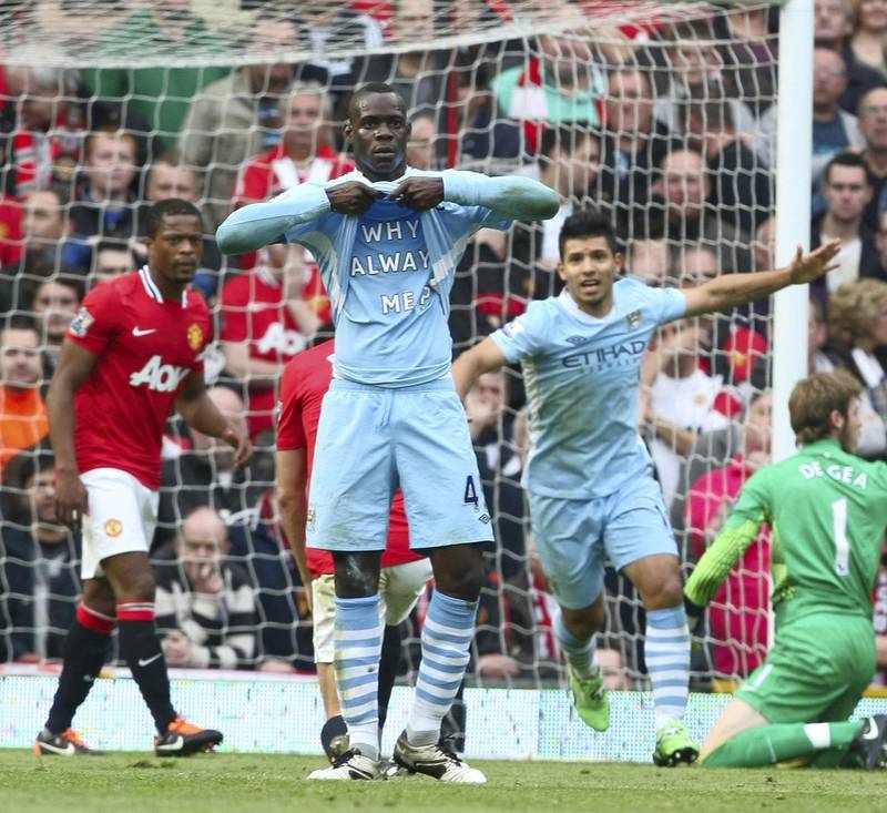 MANCHESTER, ENGLAND - OCTOBER 23:  Mario Balotelli of Manchester City celebrates scoring their first goal during the Barclays Premier League match between Manchester United and Manchester City at Old Trafford on October 23, 2011 in Manchester, England.  (Photo by Matthew Peters/Man Utd via Getty Images)
