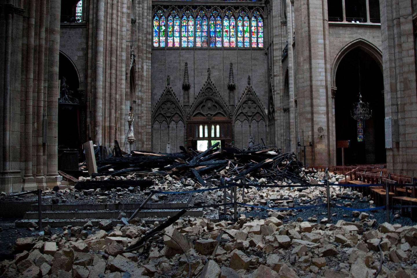 This general view shows debris inside the Notre-Dame-de Paris Cathedral in Paris on April 16, 2019, a day after a fire that devastated the building in the centre of the French capital.  French President Emmanuel Macron vowed on April 16 to rebuild Notre-Dame cathedral "within five years", after a fire which caused major damage to the 850-year-old Paris landmark. / AFP / Amaury BLIN
