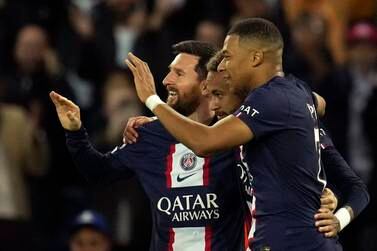 PSG's Neymar, center, celebrates PSG's Lionel Messi, left, and PSG's Kylian Mbappe, right, after scoring his side's third goal during the Champions League Group H soccer match between Paris Saint Germain and Maccabi Haifa, at the Parc des Princes stadium, in Paris, France, Tuesday, Oct.  25, 2022.  (AP Photo / Christophe Ena)
