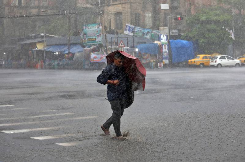 A man is buffeted by horrendous weather in Kolkata. Reuters