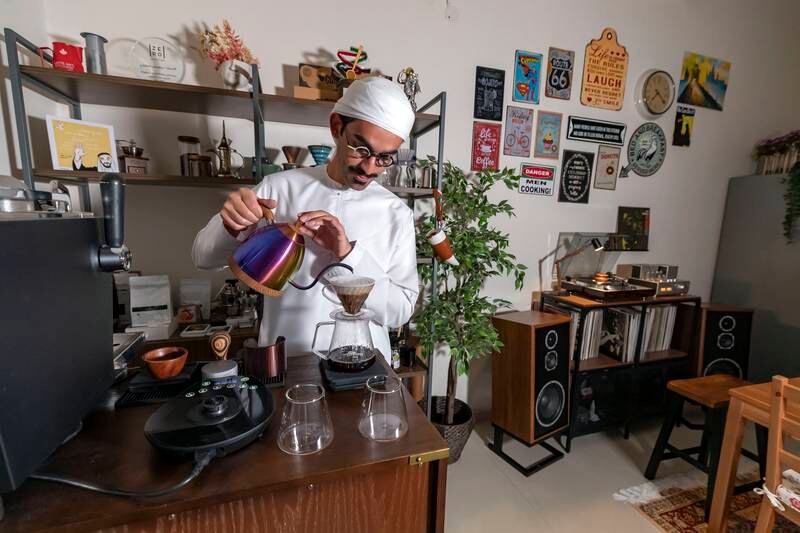 Alalawi plays his jazz and funk records at his Things Speciality Coffee & Concept Store in Abu Dhabi