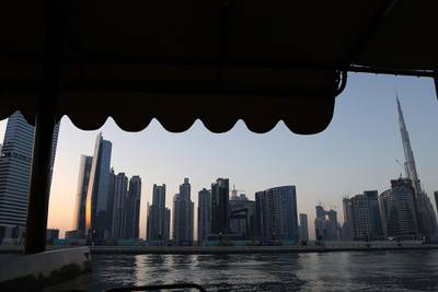 DUBAI , UNITED ARAB EMIRATES – May 17 , 2017 : View of the Dubai Skyline from the Abra at Dubai Water Canal in Dubai. The ticket price for one trip is 25 AED per person and the total time of this ride is around 45 minutes. People can see the Burj Khalifa and other buildings from Abra during the ride. ( Pawan Singh / The National ) For News / Photo Feature. ID No :- 18945 *** Local Caption ***  PS1705- DUBAI CANAL19.jpg