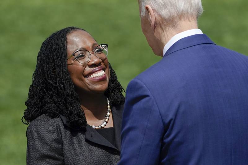 Ms Jackson shakes hands with President Joe Biden after he introduces her to speak at an event in Washington. AP