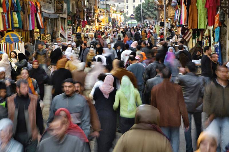 B3T8YB Motion blur of crowded street scene, Khan el Khalili Bazaar, Cairo, Egypt