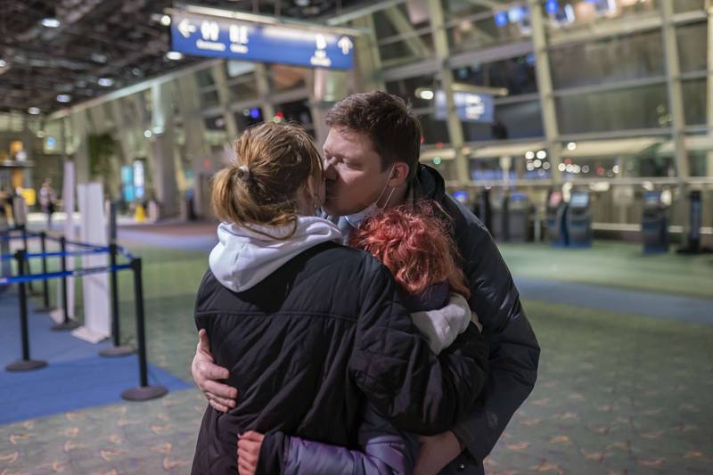 Sergey Korenev says goodbye to his two daughters. Getty Images / AFP