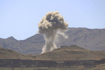 Smoke billows following an air strike by the Saudi-led coalition in the Yemeni capital Sanaa on February 23, 2020.  / AFP / MOHAMMED HUWAIS
