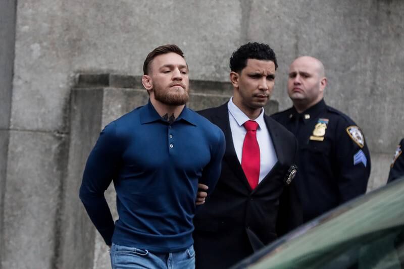 Conor McGregor walks out of the 78th police precinct after charges were laid against him following a late night melee in the Brooklyn borough of New York City on April 6, 2018.