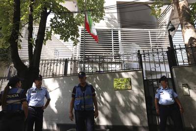 Police stand guard outside the Iranian embassy in Tirana, Albania. AP