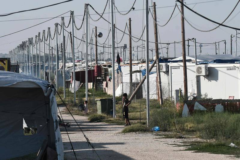 A boy stands at Nea Kavala camp, near the city of Kilkis, northern Greece.  Some 1000 refugees and migrants were transferred from the Greek island of Lesbos to the Nea Kavala camp under a decision taken by the Greek government at an emergency meeting on August 31.  AFP