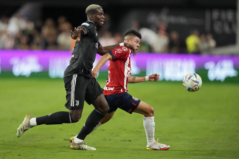 Juventus' Paul Pogba, left, and Chivas' Pavel Perez battle for the ball during their friendly in Las Vegas on Friday, July 22, 2022. AP