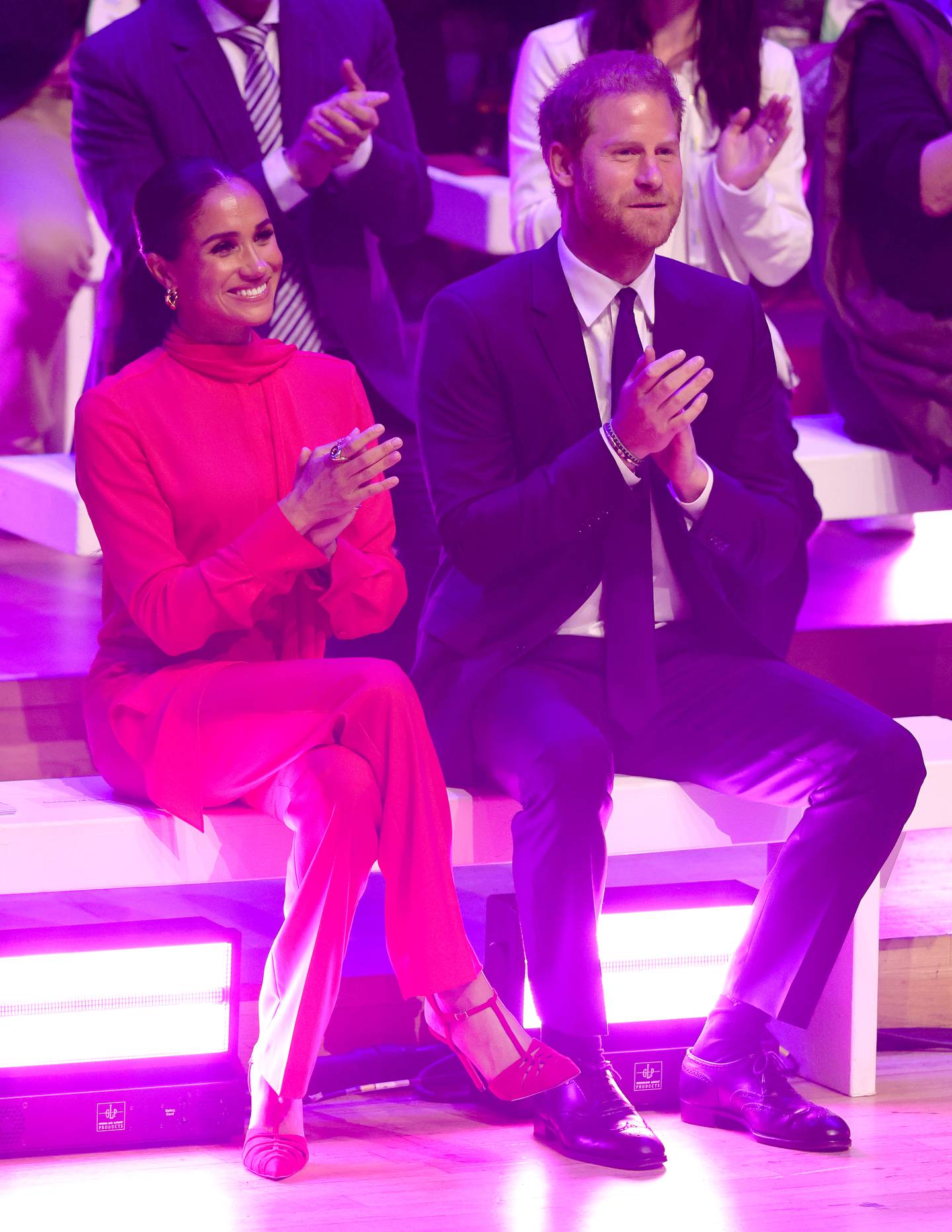 Meghan, Duchess of Sussex, in head-to-toe red, down to her crimson suede pumps. Getty Images