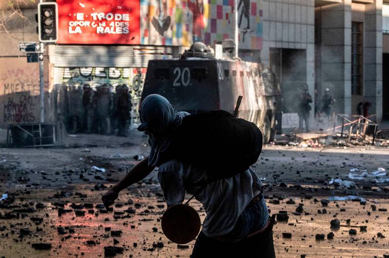 A demonstrator clashes with security forces. AFP