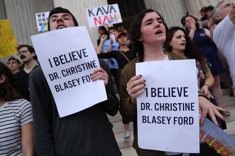 Protesters demonstrate on the steps of the U.S. Supreme Court building against the swearing in of Supreme Court nominee Justice Brett Kavanaugh inside the building in Washington, U.S. October 6, 2018.  REUTERS/Jonathan Ernst