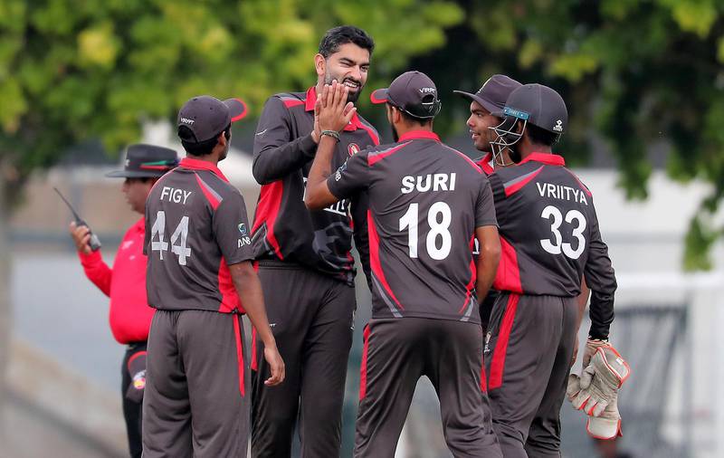 DUBAI, UNITED ARAB EMIRATES , Dec 15– 2019 :- Ahmed Raza of UAE (center) celebrating after taking the wicket of Matthew Cross during the World Cup League 2 cricket match between UAE vs Scotland held at ICC academy in Dubai. ( Pawan Singh / The National )  For Sports. Story by Paul