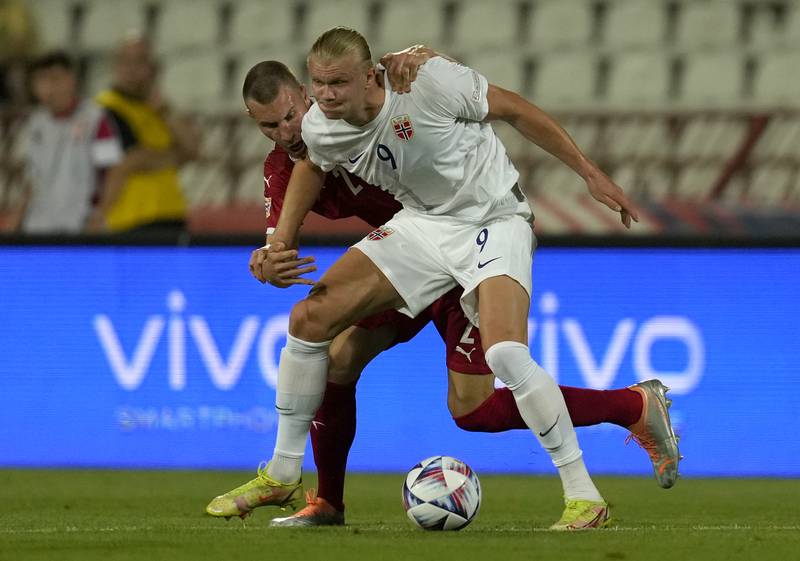 Norway's Erling Haaland, front, duels for the ball with Serbia's Strahinja Pavlovic. AP Photo 