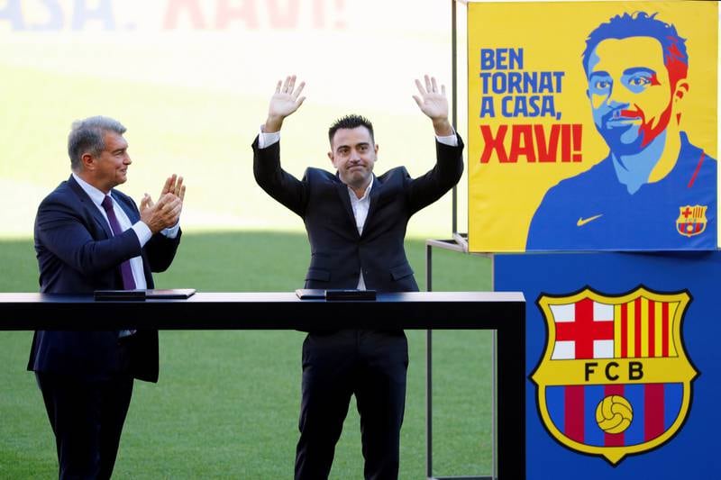 Xavi Hernandez waves to fans during his presentation at Camp Nou. EPA