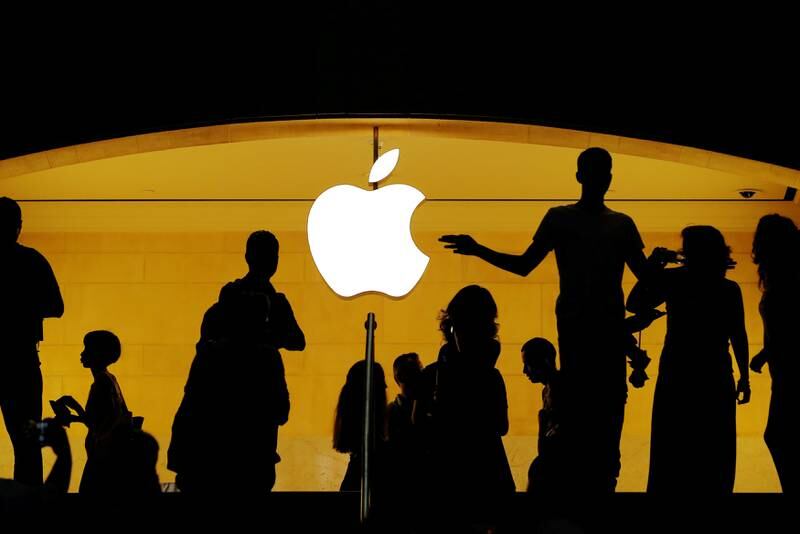 FILE PHOTO: Customers walk past an Apple logo inside of an Apple store at Grand Central Station in New York, U.S., August 1, 2018.  REUTERS/Lucas Jackson/File Photo