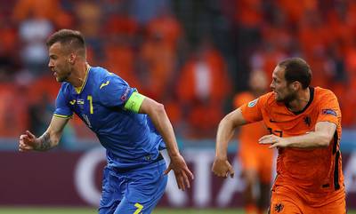 Daley Blind of the Netherlands in action against Andriy Yarmolenko of Ukraine. EPA