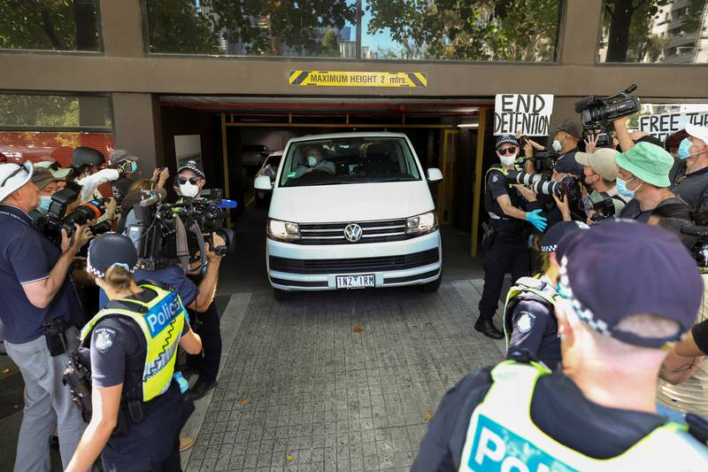 Members of the media waiting for a sighting of Serbian tennis player Novak Djokovic surround a departing transport vehicle exiting the Park Hotel, where the athlete has been held during a legal challenge over his visa, in Melbourne, Australia. Reuters