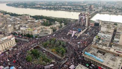 An aerial view shows Iraqi protesters gathering at Baghdad's Tahrir square near al-Jumhuriya bridge which leads to the high-security Green Zone across the Tigris River, during ongoing anti-government demonstrations in the Iraqi capital on November 2, 2019. - Iraqi security forces clashed with anti-government protesters in the early hours of Saturday near the capital's Tahrir Square, leaving one demonstrator dead and dozens more wounded, medical sources said. (Photo by - / AFP)