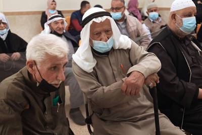 Elderly Palestinians wait for their turn to get vaccinated in Gaza City. Thousands of Palestinian health workers, the elderly, and patients with cancer or kidney disease were set to get Covid-19 vaccines as the health ministry ramped up its inoculation campaign.  AFP