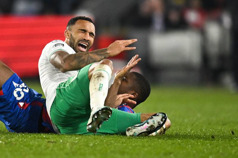 Newcastle striker Callum Wilson is tackled by Crystal Palace's Malian midfielder Cheick Doucoure. AFP