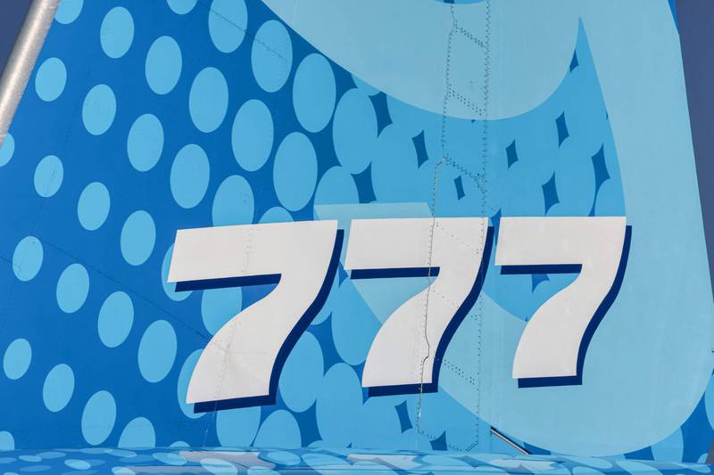 The "777" logo on the empennage (tail fin) of the Boeing 777X demonstration aircraft at the 2021 Dubai Airshow.  AFP