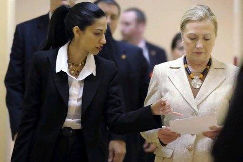 US secretary of state Hillary Rodham Clinton goes over notes with Huma Abedin, one of her senior advisors.