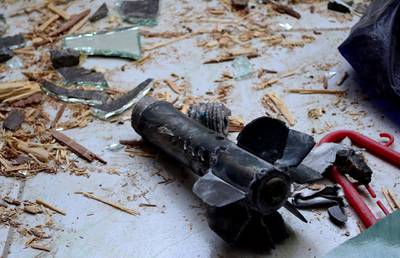 A handout picture released by the official Syrian Arab News Agency (SANA) on October 31, 2013, shows the remains of a mortar after an alleged mortar attack by rebel fighters on the Damascus mixed Christian-Druze suburb of Jaramana. Syria's entire declared stock of chemical weapons has been placed under seal, a watchdog said, as peace envoy Lakhdar Brahimi wrapped up a Syria visit to muster support for peace talks. AFP PHOTO / SANA --- RESTRICTED TO EDITORIAL USE - MANDATORY CREDIT "AFP PHOTO / SANA" - NO MARKETING NO ADVERTISING CAMPAIGNS - DISTRIBUTED AS A SERVICE TO CLIENTS --- (Photo by - / SANA / AFP)