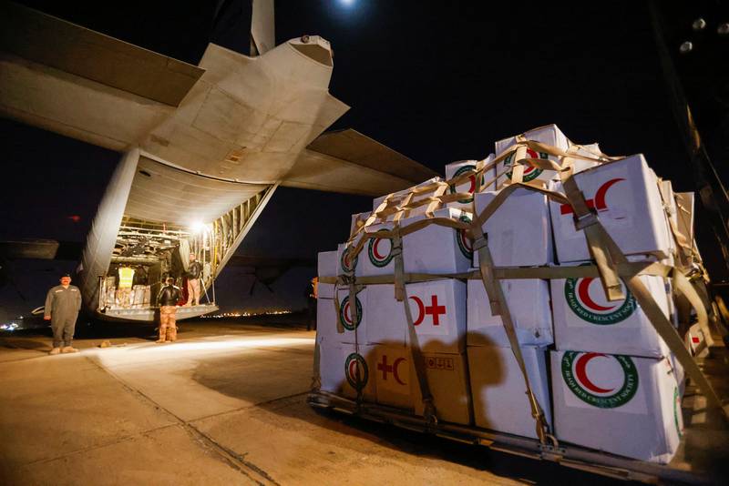 Ground crews in Baghdad load a Red Crescent cargo into a plane that will leave for the earthquake zone in northern Syria. Reuters