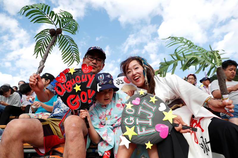 Fans pose for a photograph at the  Fiji v Uruguay game, Kamaishi Recovery Memorial Stadium, Kamaishi, Japan. Reuters