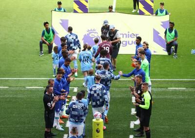 Chelsea give Manchester City players a guard of honour before the match. Reuters