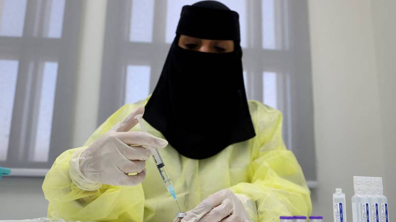 Deemah Al Sofyani, a pharmacist, prepares a Covid-19 vaccine does in Riyadh, Saudi Arabia.  Reuters